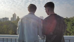 Stock Video Men Looking At The City In A Balcon Animated Wallpaper