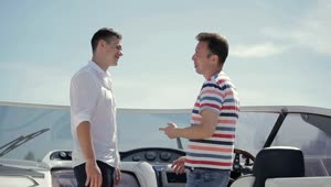 Stock Video Men Handshake Over Deal On Deck Of Yach Animated Wallpaper