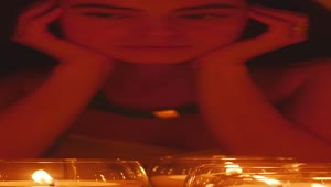 Stock Video Meditative Face Of A Young Spiritual Woman Appreciating Some Burnin Animated Wallpaper