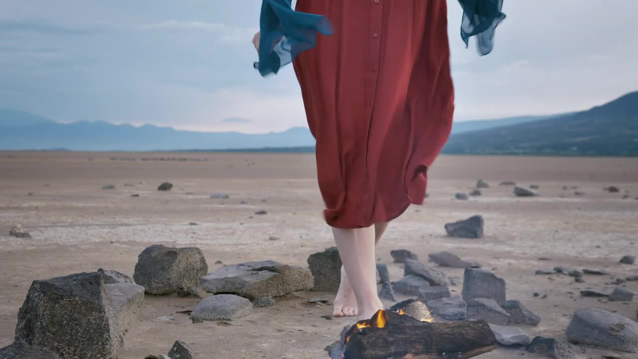 Download Stock Video Meditating In The Middle Of A Desert With A Campfir Animated Wallpaper