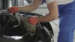 Stock Video Mechanic Repairing A Car Engin Animated Wallpaper