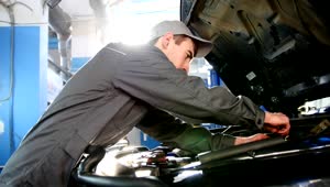 Stock Video Mechanic In Overalls Working Under The Hood Of A Ca Animated Wallpaper
