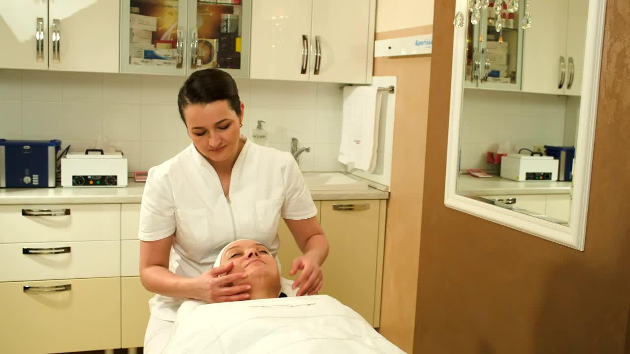 Download Stock Video Massage Therapist Giving A Face Massag Animated Wallpaper