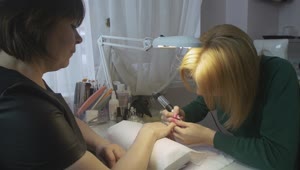 Stock Video Manicurist Clearing The Nail Surfac Animated Wallpaper