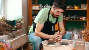 Stock Video Man Working With Clay In The Pottery Studi Animated Wallpaper
