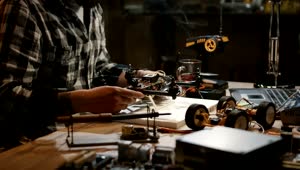 Stock Video Man Working On Repairing Drone Circuit Animated Wallpaper