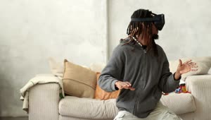 Stock Video Man With Virtual Reality Glasses Doing Gesture Animated Wallpaper
