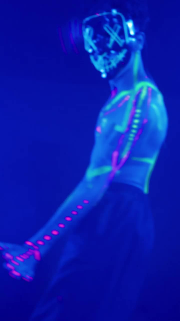 Download Stock Video Man With Neon Mask Dancing With Party Ligh Animated Wallpaper