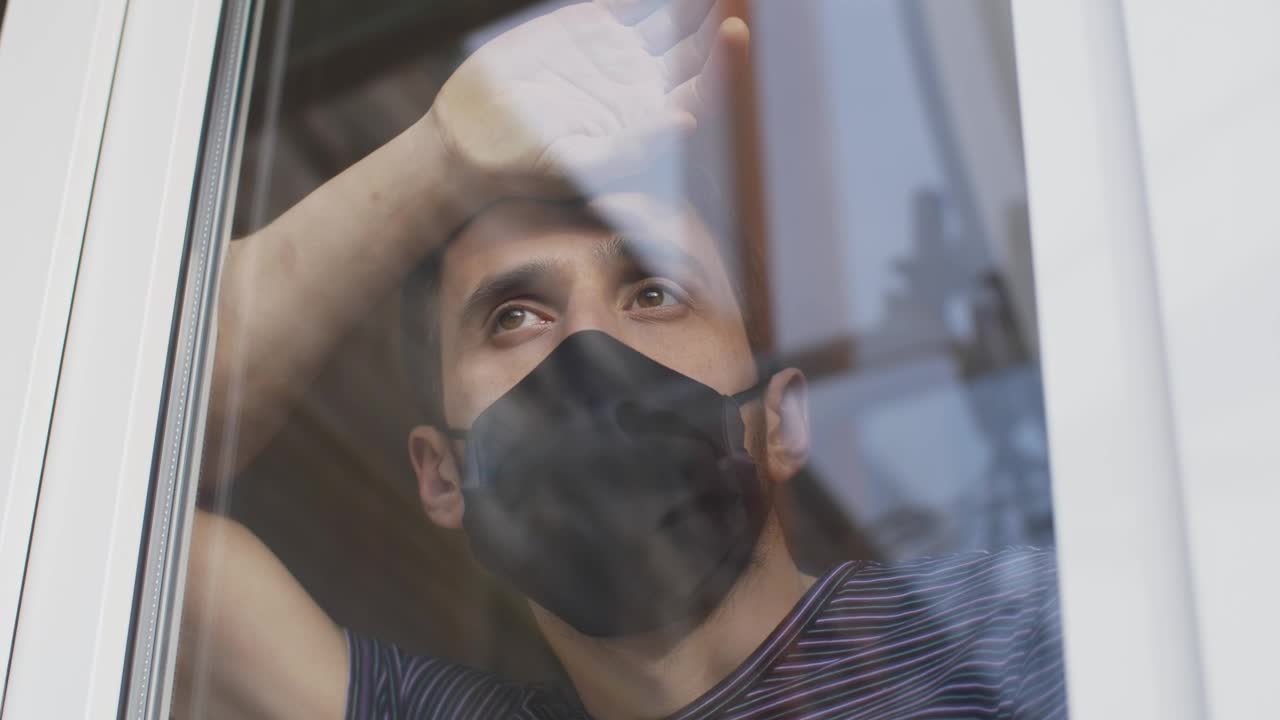Download Stock Video Man With Mask Looking Out From The Windo Animated Wallpaper