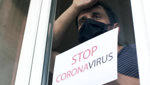 Stock Video Man With Mask And A Sign Against The Coronaviru Animated Wallpaper