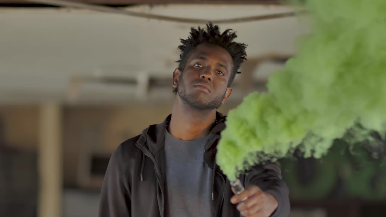 Download Stock Video Man With Green Smoke Bom Animated Wallpaper