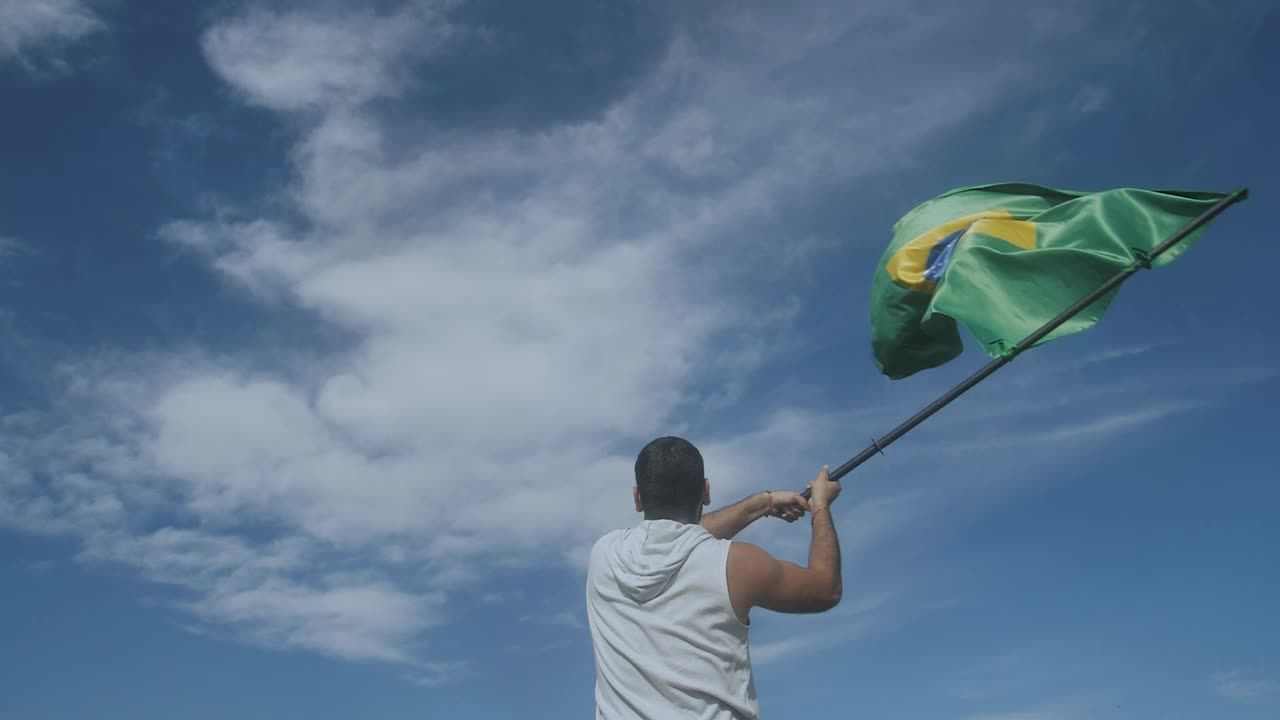 Download Stock Video Man Waving The Flag Of Brazi Animated Wallpaper