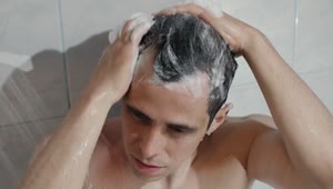 Stock Video Man Washing Hair In Bathroo Animated Wallpaper