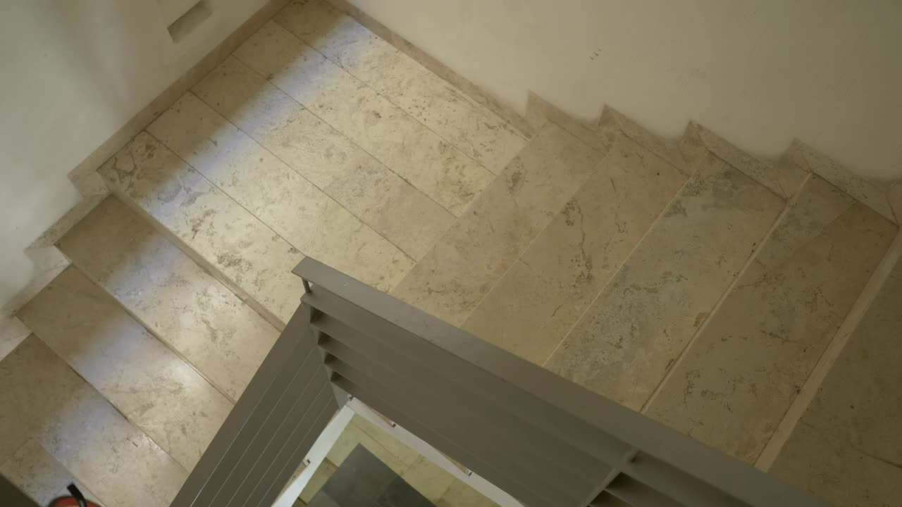 Download Stock Video Man Walking Upstairs With His Bik Animated Wallpaper