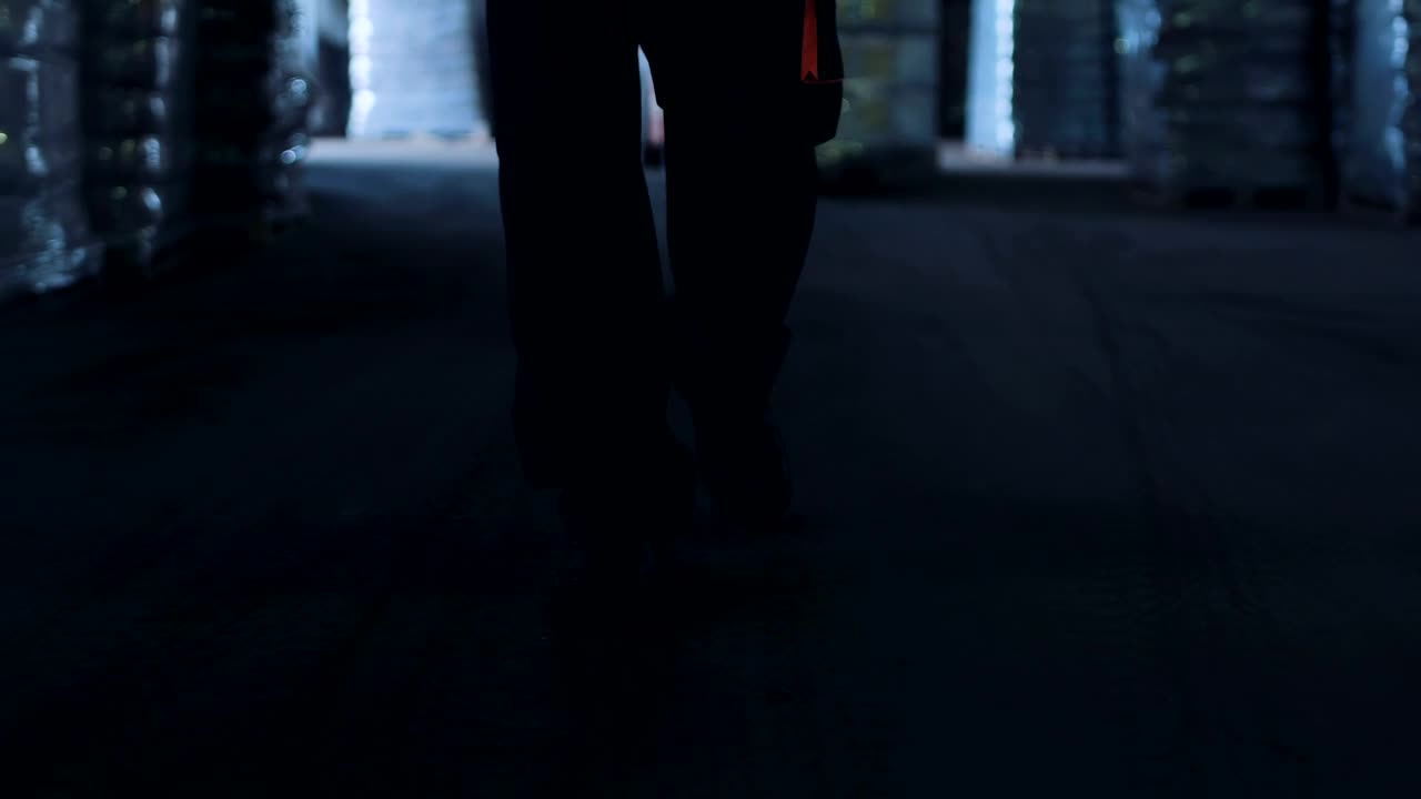 Download Stock Video Man Walking Through The Warehous Animated Wallpaper