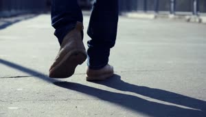 Stock Video Man Walking On The Concrete Sidewal Animated Wallpaper