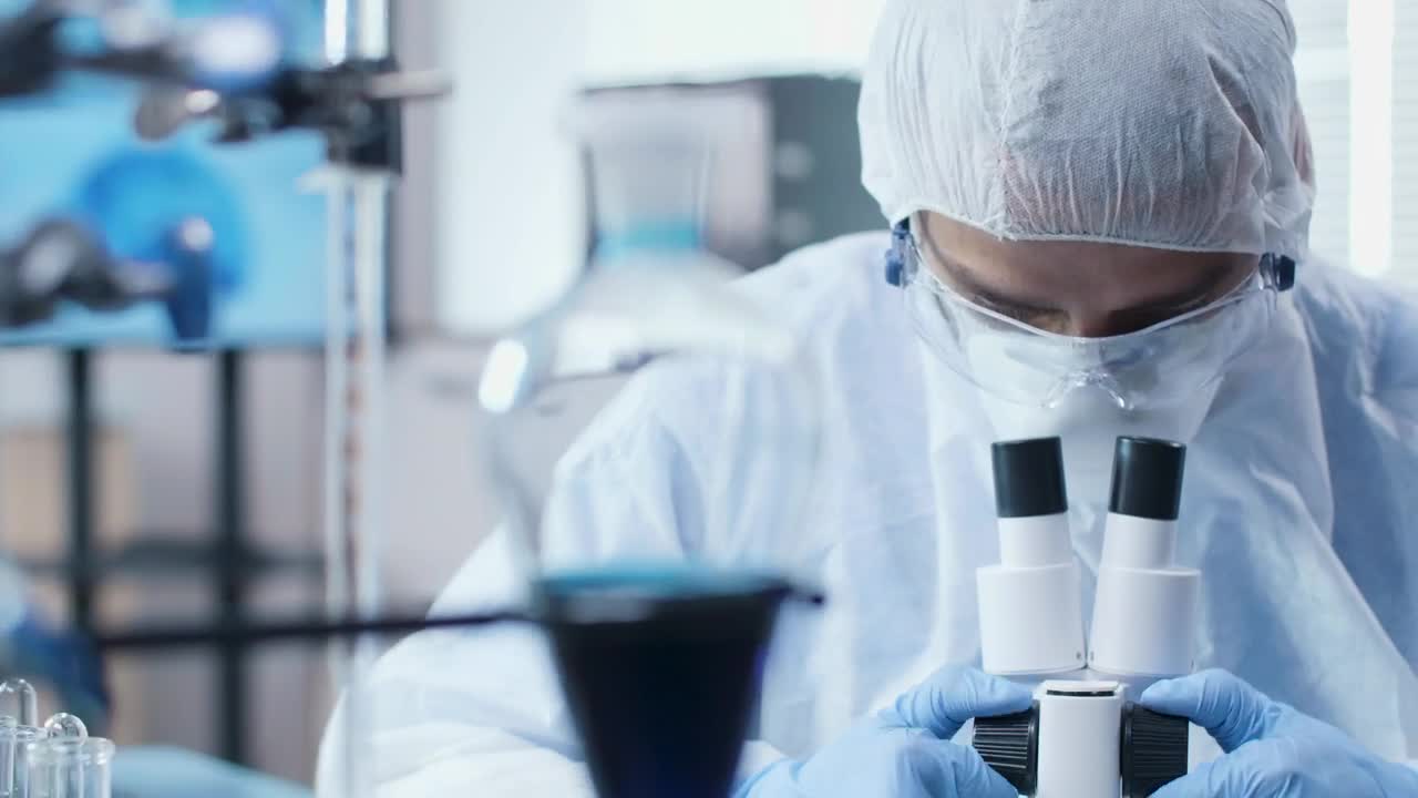 Download Stock Video Man Using A Microscop Animated Wallpaper