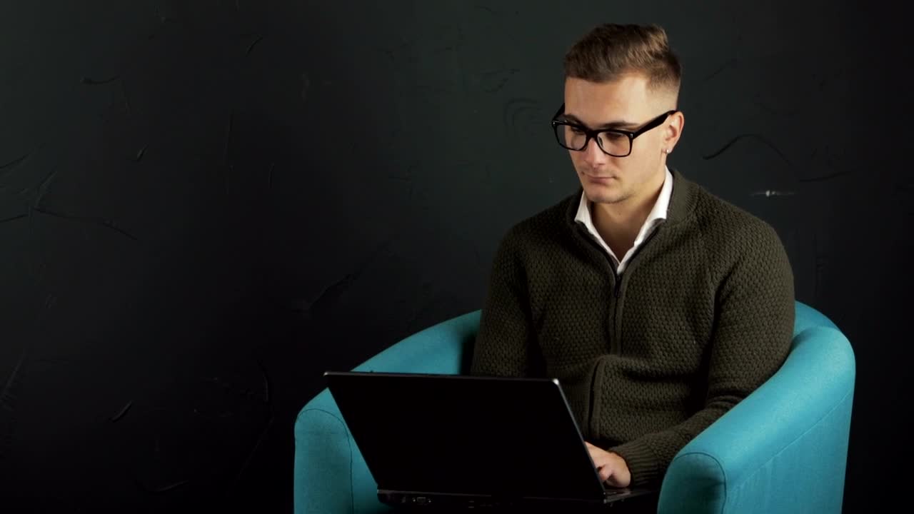 Download Stock Video Man Typing On Laptop With Black Backgroun Animated Wallpaper