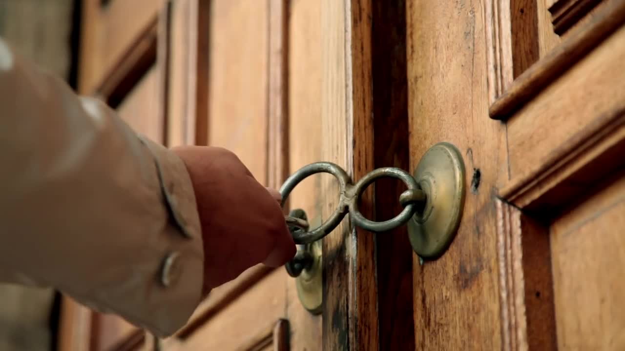 Download Stock Video Man Tries To Open A Padlocked Wooden Doo Animated Wallpaper