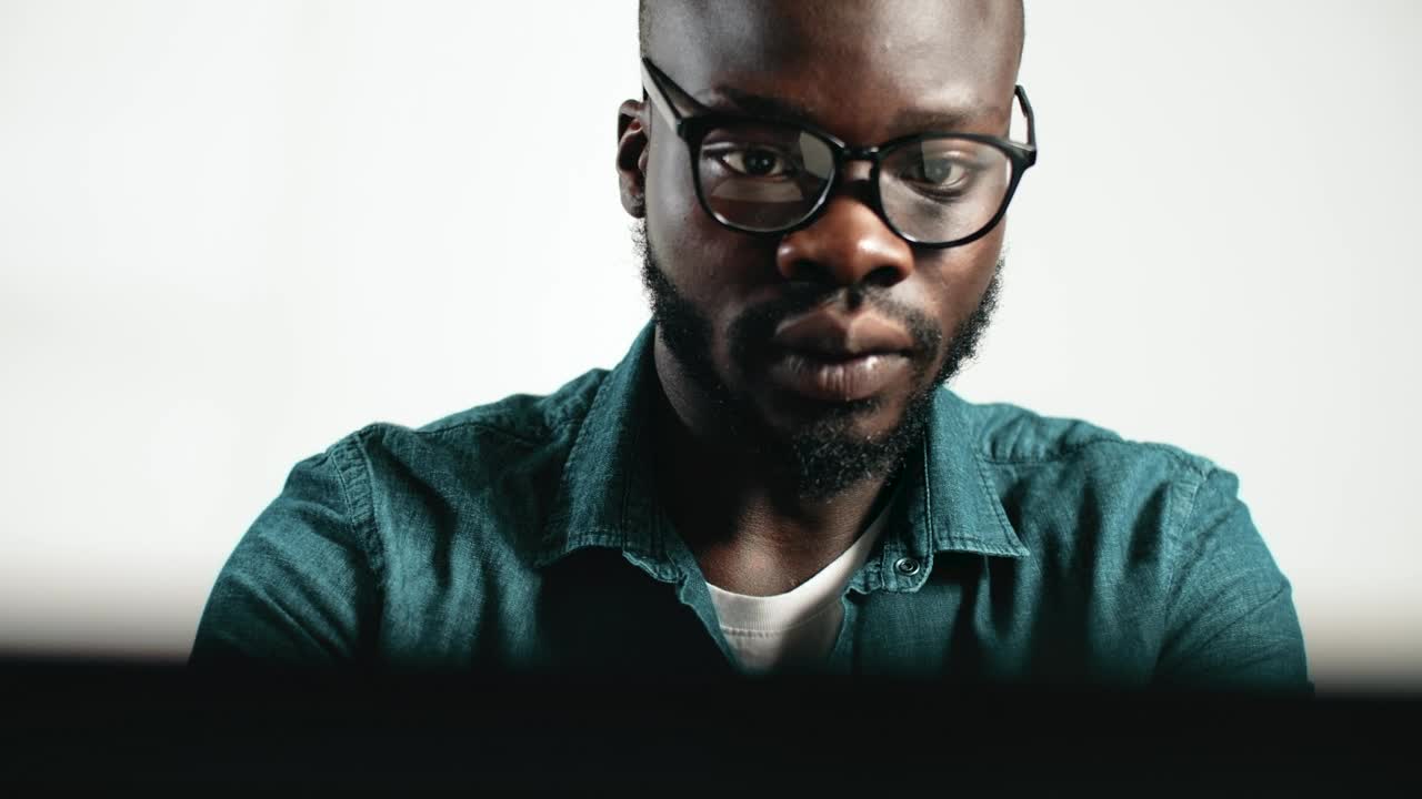 Download Stock Video Man Thinks And Takes Off Glasses While Workin Animated Wallpaper