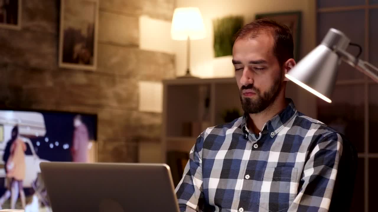 Download Stock Video Man Thinking While Working On A Lapto Animated Wallpaper