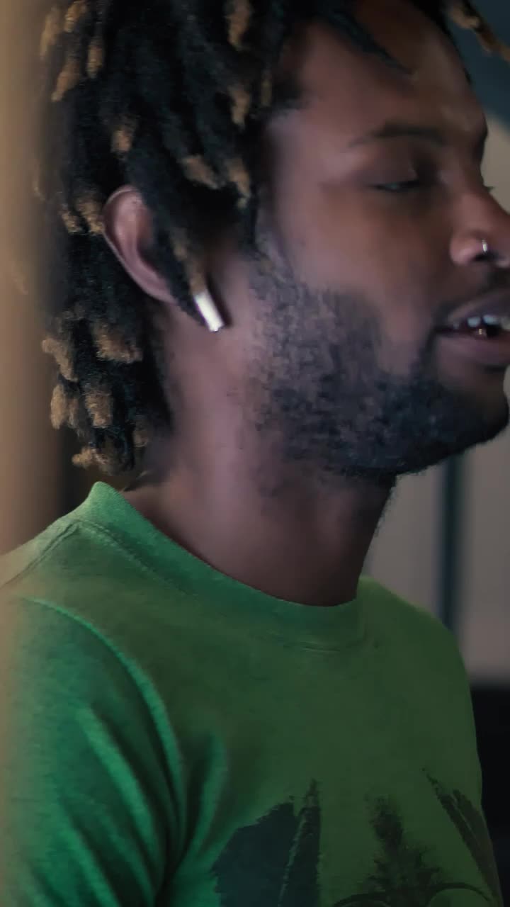 Download Stock Video Man Talking On The Phone With White Earphone Animated Wallpaper