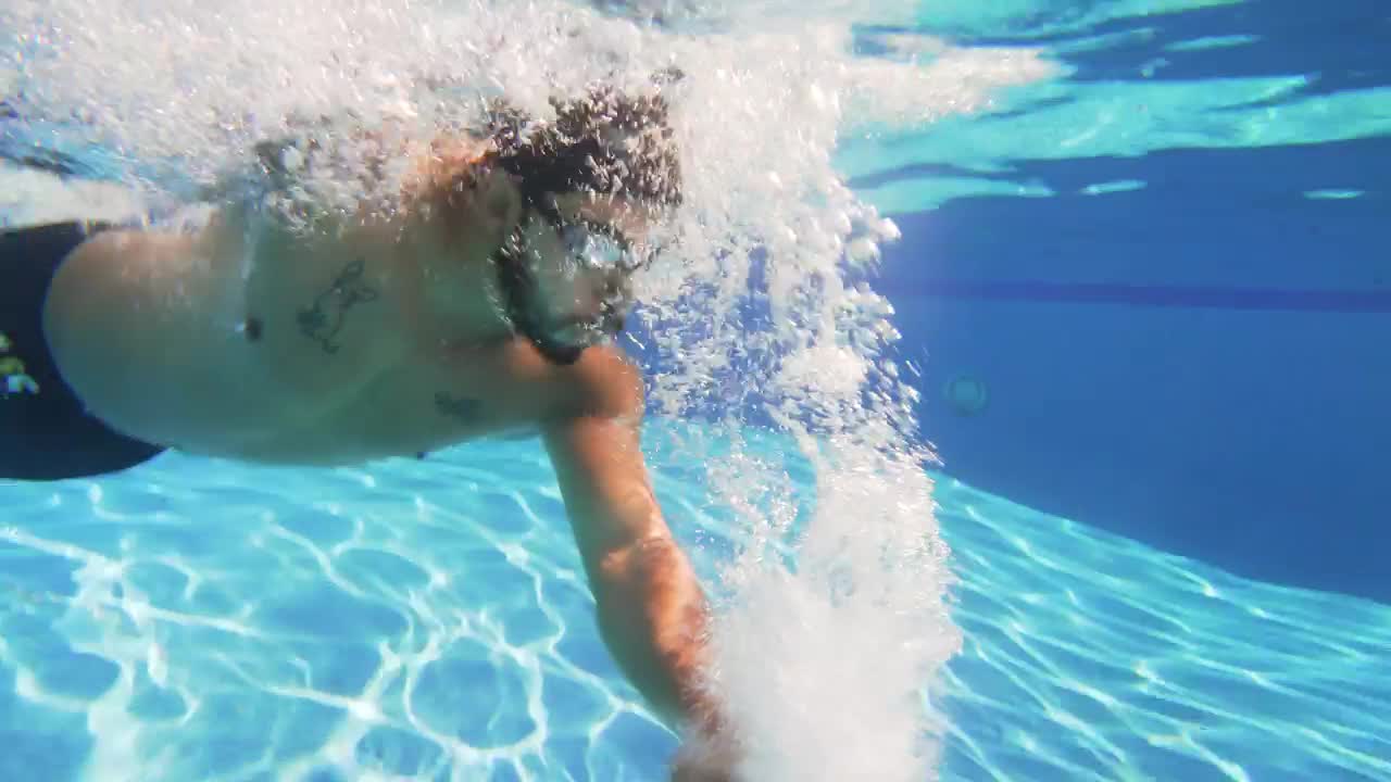 Download Stock Video Man Swimming In A Poo Animated Wallpaper