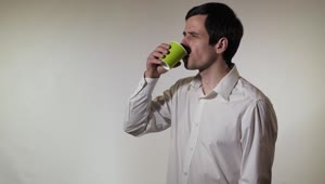 Stock Video Man Spills His Drink While Drinking I Animated Wallpaper