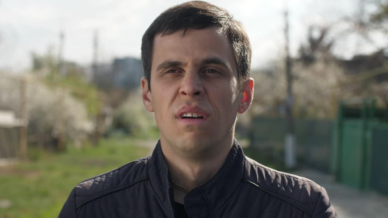 Download Stock Video Man Sneezing Outdoor Animated Wallpaper