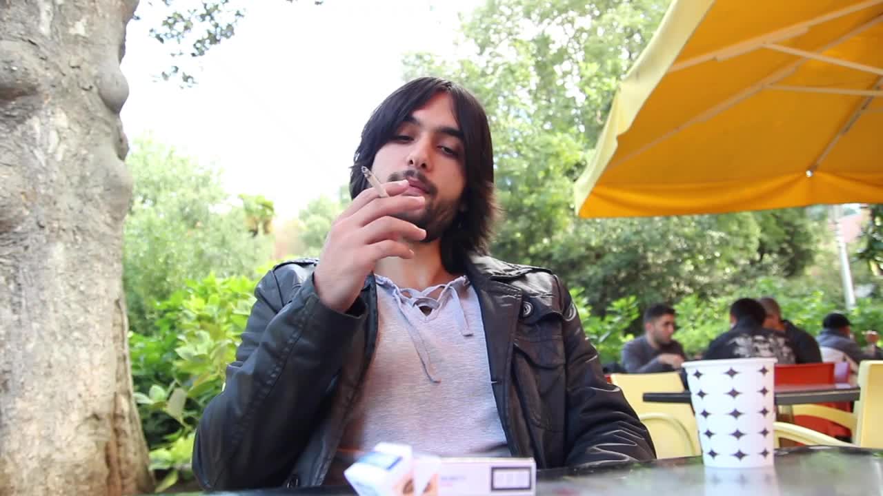 Download Stock Video Man Smoking And Drinking Coffee Outdoor Sho Animated Wallpaper