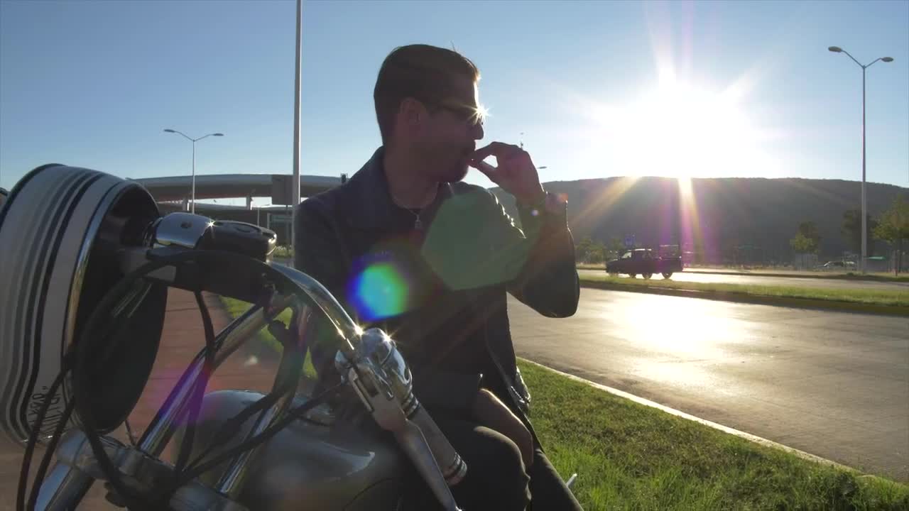 Download Stock Video Man Sitting On His Motorcycl Animated Wallpaper