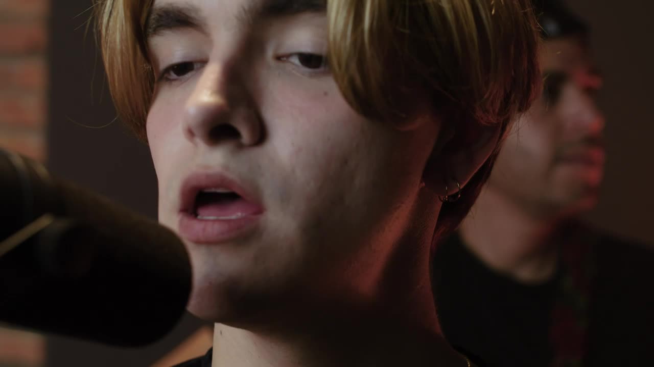 Download Stock Video Man Singing In Front Of A Studio Microphon Animated Wallpaper