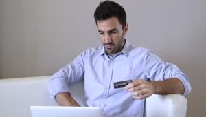 Stock Video Man Shopping Online With His Credit Card Dat Animated Wallpaper