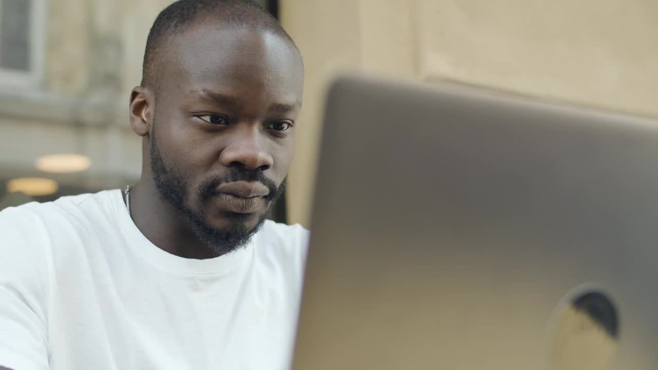 Download Stock Video Man Reacts In Pain To News On Lapto Animated Wallpaper