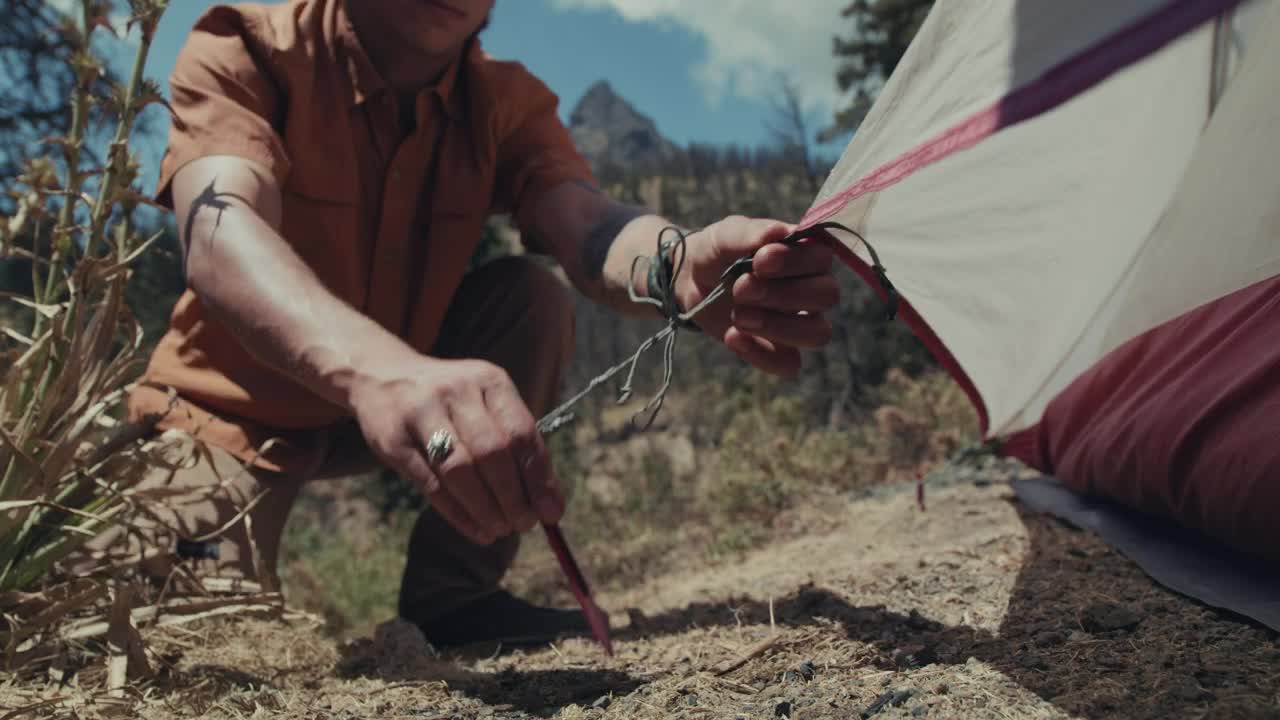 Download Stock Video Man Putting Up His Ten Animated Wallpaper