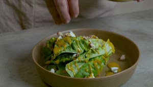 Stock Video Man Preparing A Salad With Various Ingredient Animated Wallpaper