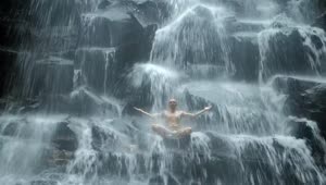 Stock Video Man Practicing Mind Body Meditation In Waterfal Animated Wallpaper