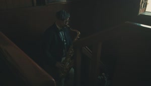 Stock Video Man Playing The Saxophone In The Stair Animated Wallpaper