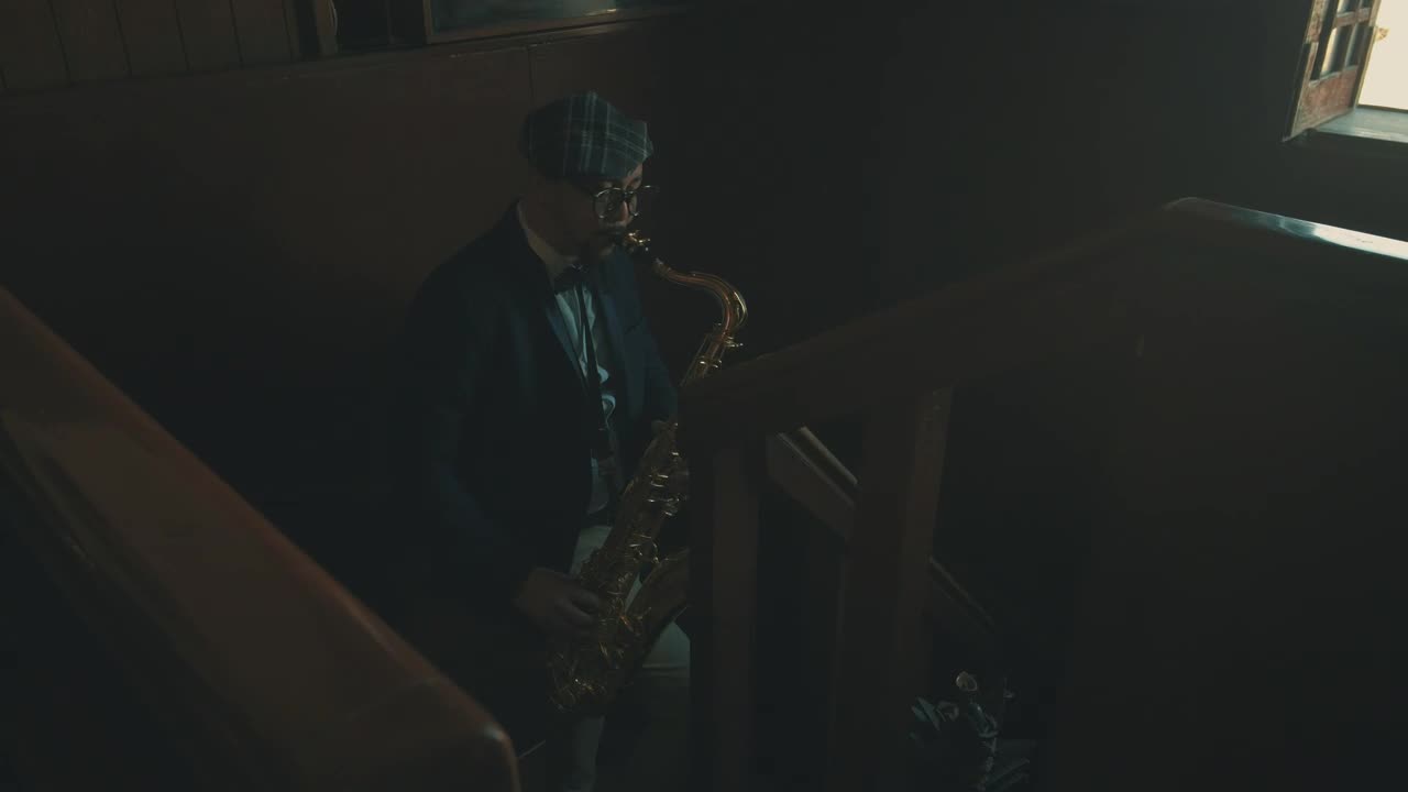 Download Stock Video Man Playing The Saxophone In The Stair Animated Wallpaper
