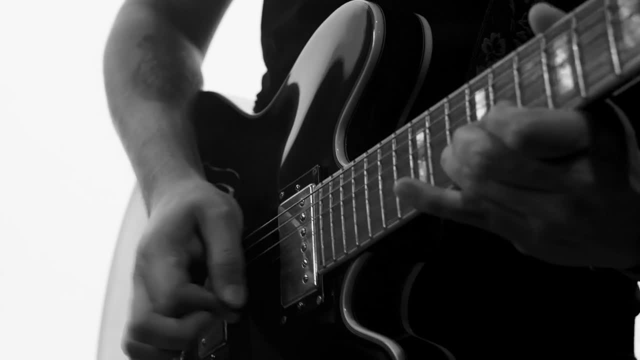 Download Stock Video Man Playing Electric Guitar Black And Whit Animated Wallpaper