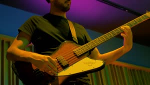 Stock Video Man Playing Bass During A Live Performanc Animated Wallpaper