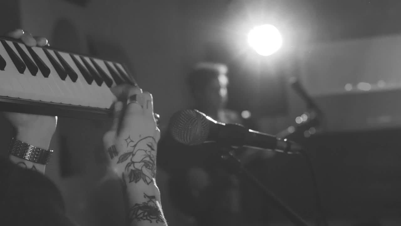 Download Stock Video Man Playing A Keyboard In Front Of A Microphon Animated Wallpaper