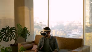 Stock Video Man Moves With Virtual Reality Glasse Animated Wallpaper