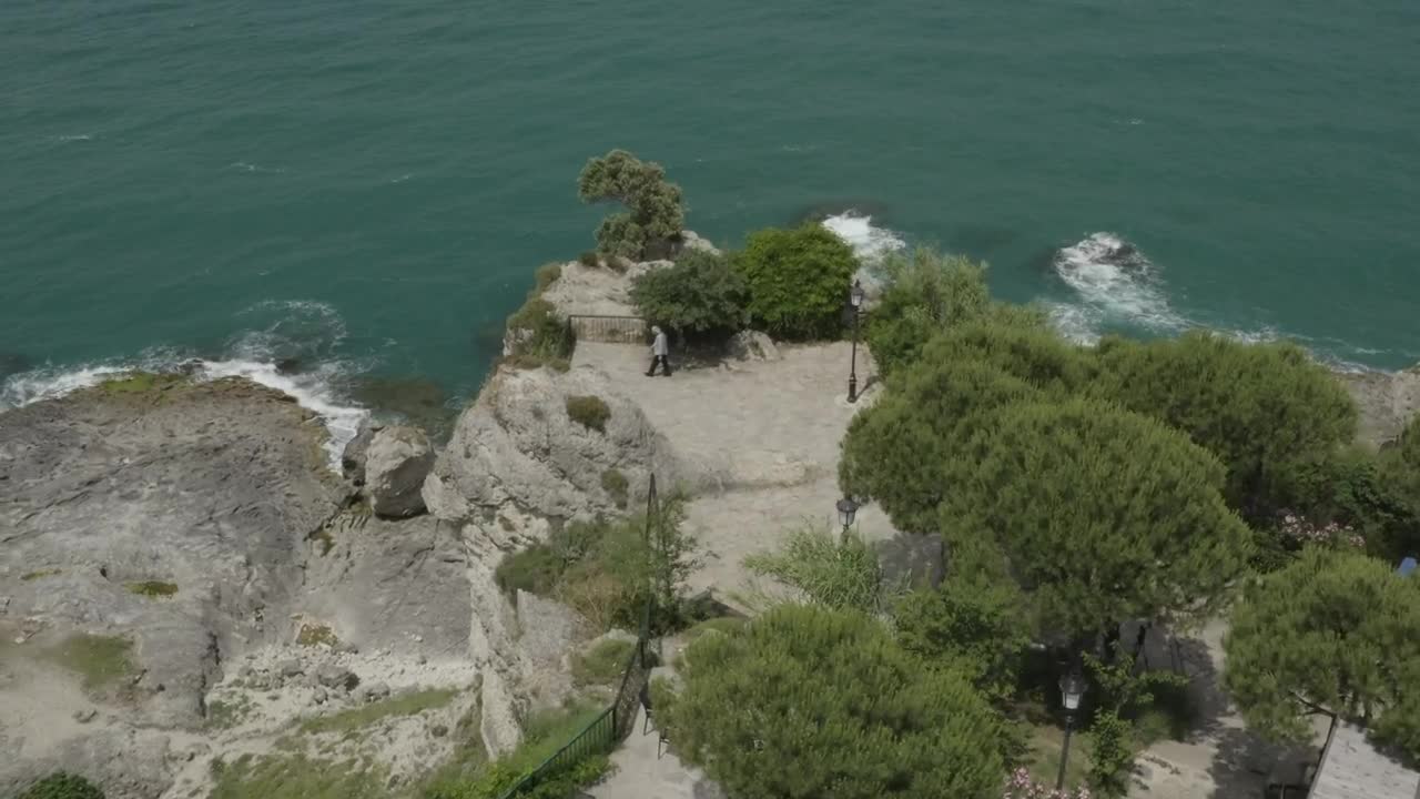 Download Stock Video Man Looking Down Over Cliff Animated Wallpaper