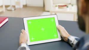 Stock Video Man Looking At A Tablet With Green Scree Animated Wallpaper