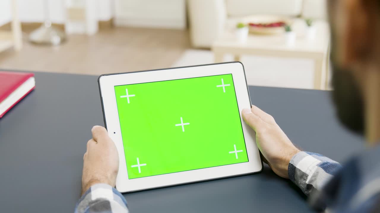 Download Stock Video Man Looking At A Tablet With Green Scree Animated Wallpaper