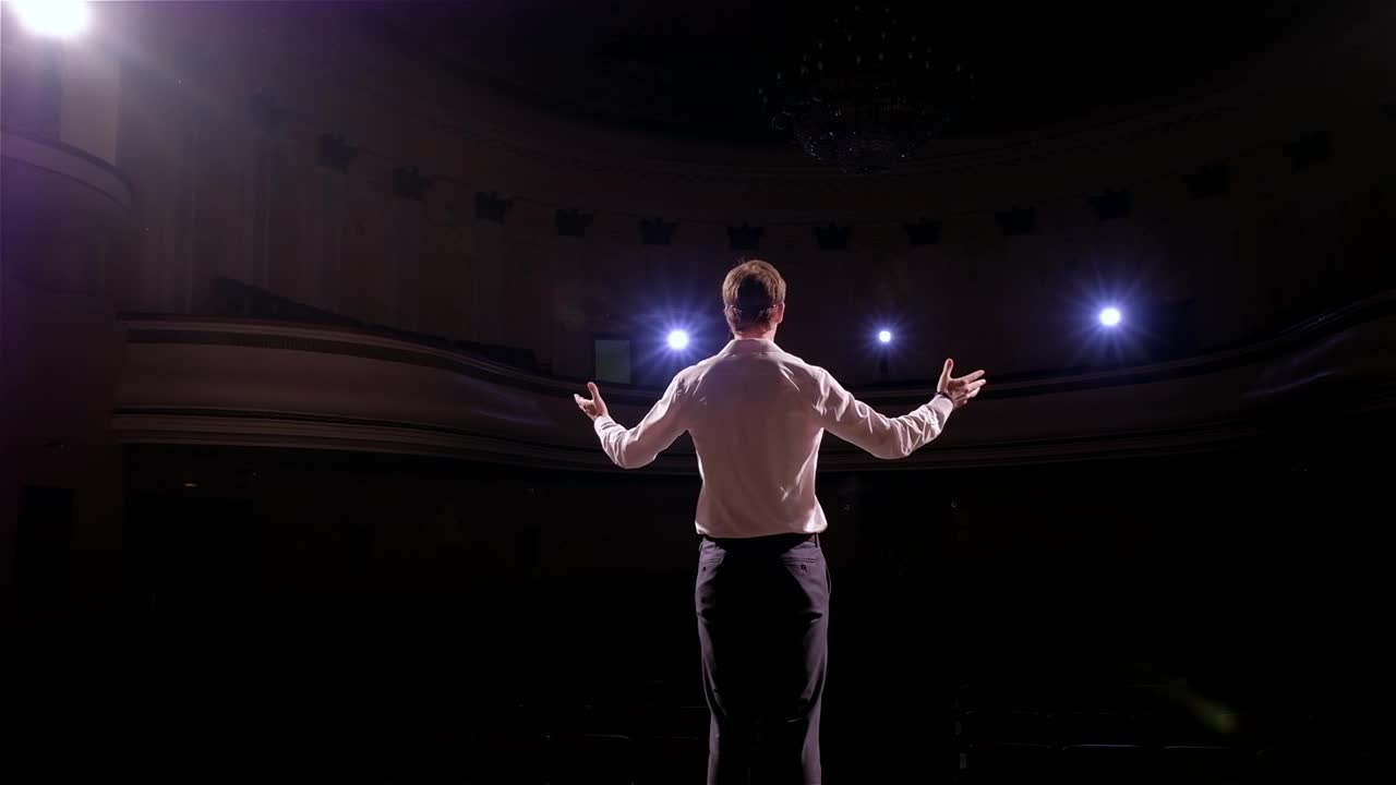 Download Stock Video Man Introduces Himself To Seminar Audienc Animated Wallpaper