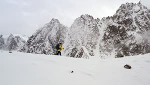 Stock Video Man In Yellow Coat Climbing Ridge In Himalaya Animated Wallpaper
