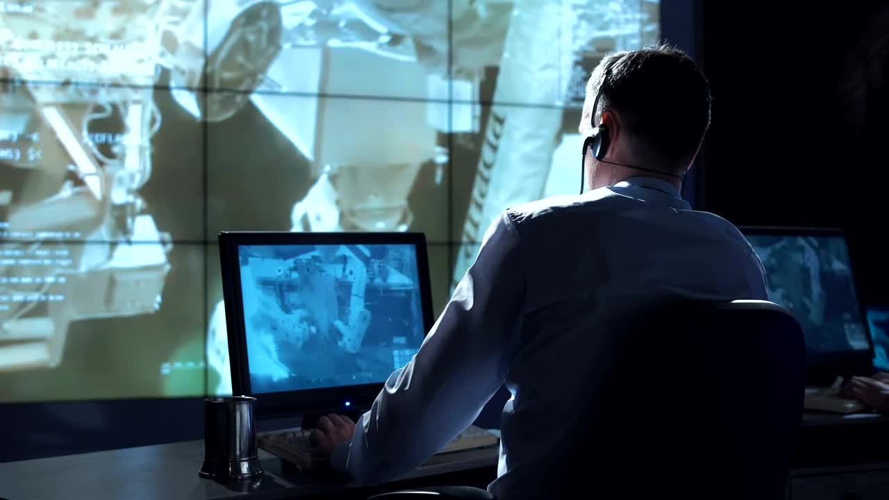 Download Stock Video Man In The Space Station Mission Contro Animated Wallpaper