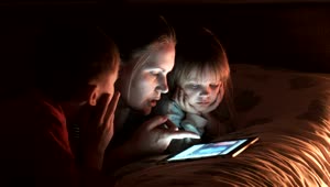 Stock Video Mother With Two Children Watching The Tablet Live Wallpaper